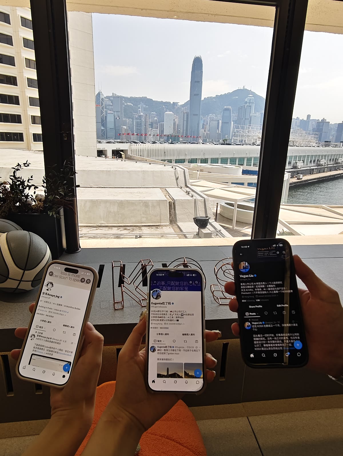 Sharing our profiles at KOSX, with Hong Kong harbour outside the window